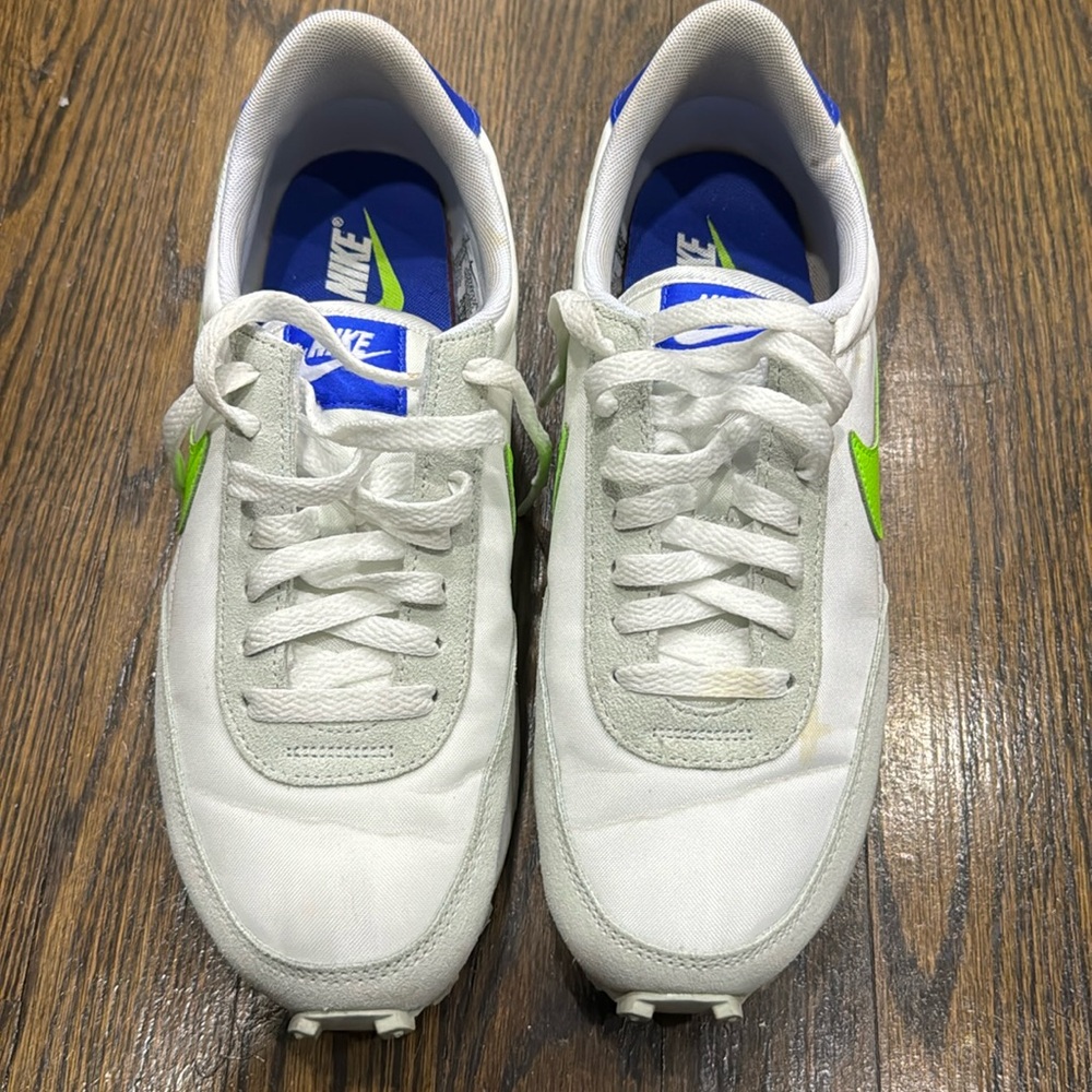 Green and white Nike